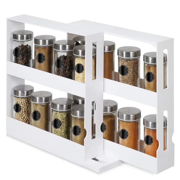 White two-tier swivel spice rack with the front rack pulled out, holding glass spice jars on four shelves